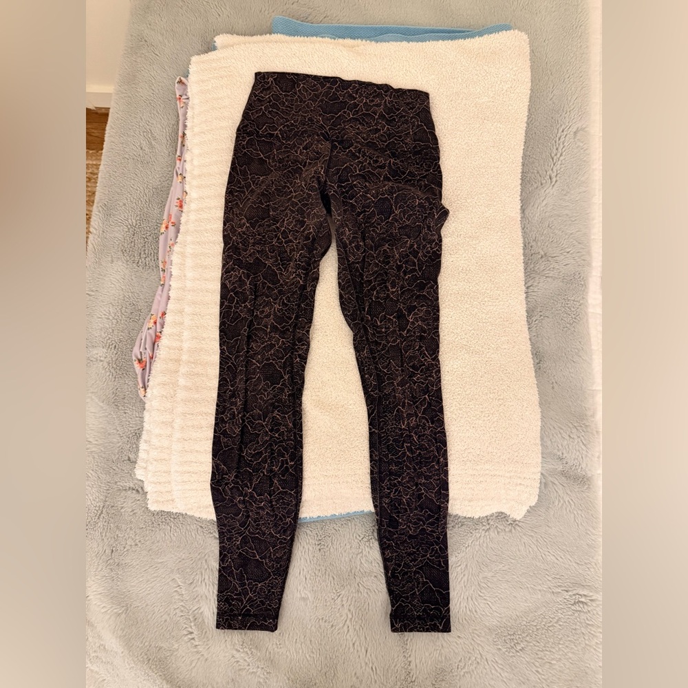 Lululemon black & pink lace print align leggings. 28” length. Size 6.